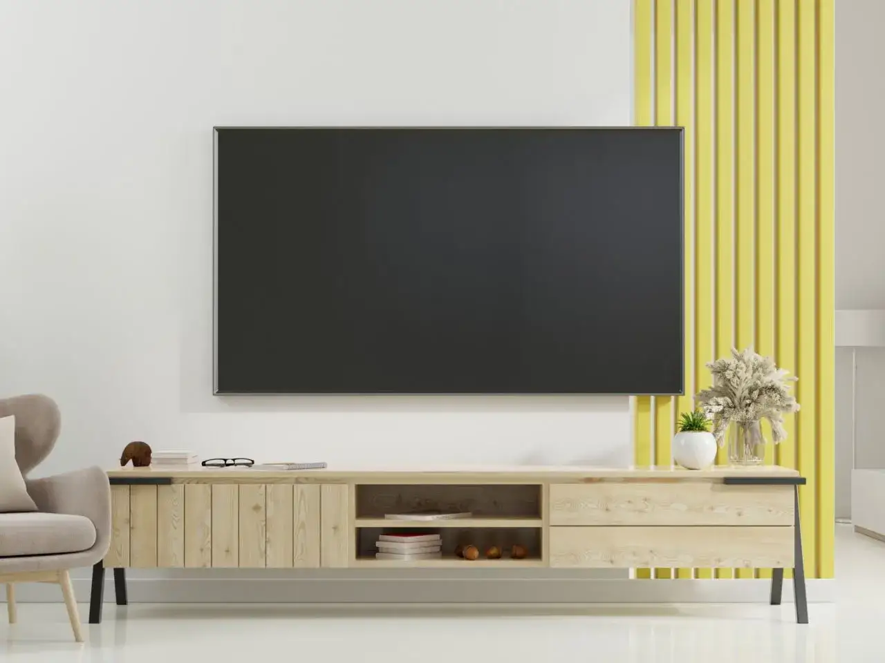 Eleganckie rozwiązanie, jak ukryć kable od telewizora na ścianie bez kucia. Minimalistyczna szafka RTV i nowoczesny telewizor.